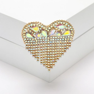 Detail of elegant heart-shaped tassel brooch with rainbow AB rhinestones on golden base