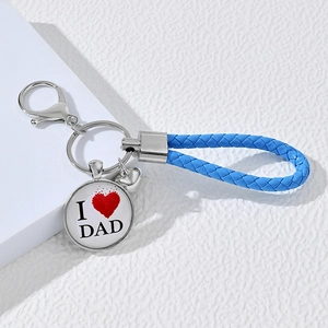 Detailed shot of a blue braided keychain with 'I ❤️ DAD' alloy pendant and spring clasp
