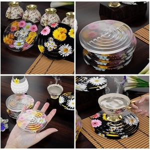 Detail view of round daisy coaster molds with concentric non-slip groove design