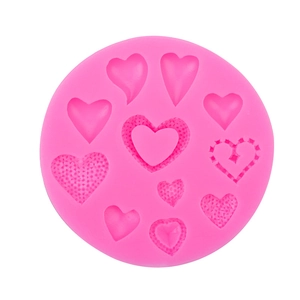 Pink heart-shaped silicone mold with ten diverse cavities for DIY fondant and chocolate