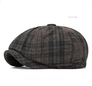 Close-up of gray checkered wool newsboy cap with high-quality woven texture