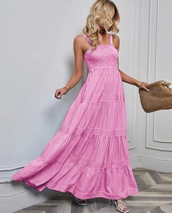 Detail shot of pink and white striped tiered dress with pleated bust and slim straps