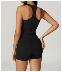 Rear view of tight black racerback tank top and high waist compression shorts set