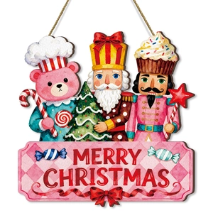 Pink wooden Nutcracker and bear Christmas door hanger with Merry Christmas lettering