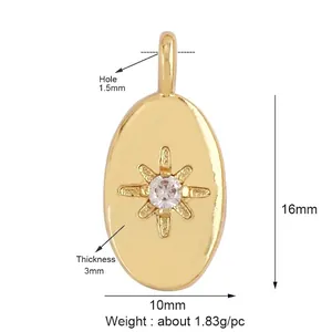 Detail of 16mm gold oval pendant featuring a starburst-set clear zircon on white background