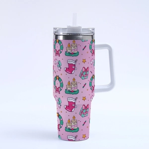 Close-up of pink Christmas tumbler with festive wreaths and holiday gift illustrations
