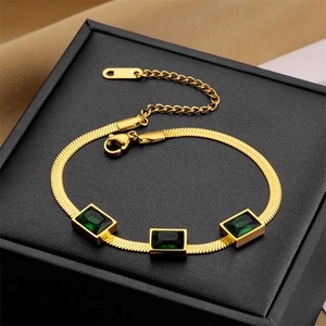 Gold-plated flat snake chain bracelet with three square green crystal charms