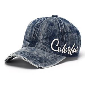 Detail of vintage navy denim baseball cap with white Colorful script embroidery