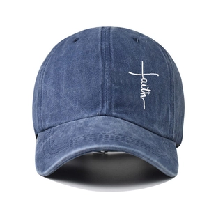 Blue washed cotton baseball cap featuring white Faith cross embroidery on the front