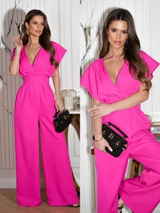 Detail of rose red V-neck wide leg jumpsuit with waist tie and flowy fabric texture