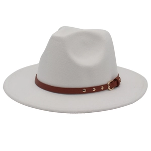 Detail of white felt jazz hat featuring a brown leather belt with gold buckle and studs
