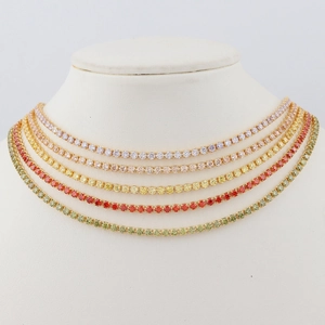 Detail of five colorful tennis chain necklaces with multi-color zircon stones on a neck model