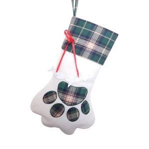 Cat paw Christmas stocking with green plaid patterns and red bow for holiday decor
