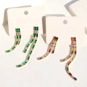 Minimalist long tassel earrings with green and colorful zircons in gold finish on cards