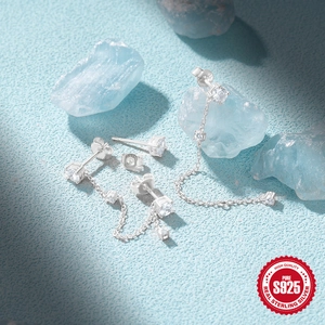 925 Sterling Silver tassel chain earrings with cubic zirconia on light blue background