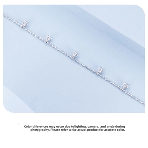 Detailed close-up of s925 silver ball chain bracelet featuring square cubic zirconia stones