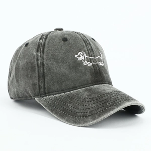 Detail of dachshund embroidery on vintage washed cotton baseball cap in charcoal gray