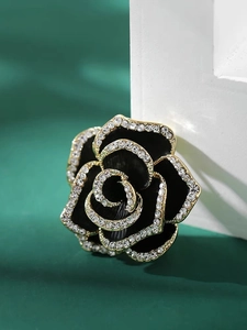 Vintage black camellia flower brooch with crystal border on golden alloy setting