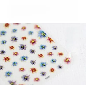 Macro shot of 5D ultra-thin matte floral nail stickers with colorful small flower patterns