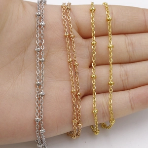 Detailed close-up of stainless steel ball chains in silver, gold and rose gold finishes