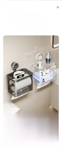 Detail of suction cup bathroom organizer showing wall-mounted paper holder and top shelf