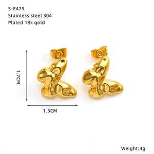 Detail showing 18k gold plated stainless steel bow earrings with exact 1.7cm height measurements