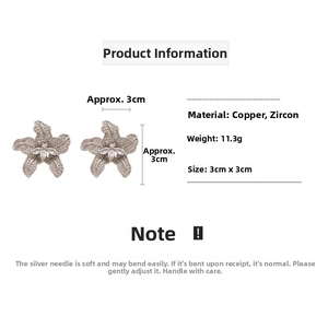 Detailed view of zircon flower earrings with dimensions 3cm by 3cm and silver needles