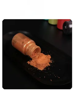 Detail of bronze mica powder in a glass vial for DIY resin and candle making craft