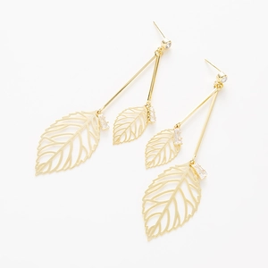 Elegant gold leaf dangle earrings with white zircon stones on a clean white background