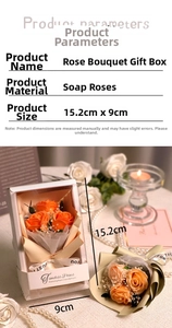 Detail of orange soap rose bouquet in a gift box with a transparent window and ribbon