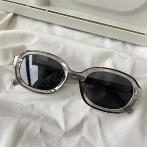 Translucent grey oval sunglasses with black lenses for cycling and outdoor sports