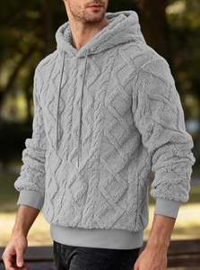 Detail of light gray hoodie featuring thick diamond pattern fleece fabric and drawstring