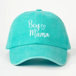 Close-up of Boy Mama white embroidery on mint green washed cotton baseball cap texture