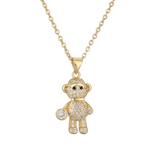 Golden necklace with a micro-pave crystal monkey pendant on a clean white background