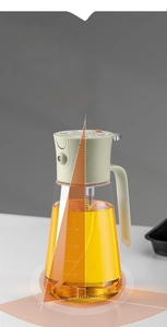 Macro view of 700ml glass oil sprayer with trapezoidal base and measurement scales