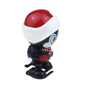 Wind-up cartoon penguin toy wearing a red Santa hat and scarf for Christmas gift