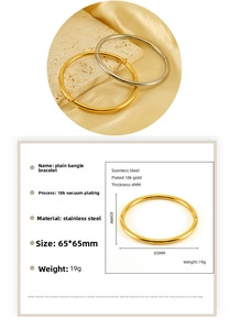 Detail view of 18K gold and silver stainless steel bangles with product specifications