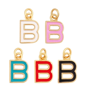Close-up of five colorful enamel letter B pendants in white pink teal red and black