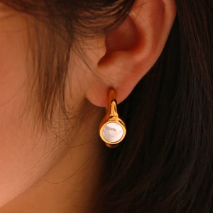 Vintage French style gold C-shape earrings with textured mother of pearl inlay
