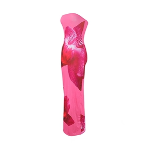 Detail view of pink bodycon tube maxi dress featuring bold red floral patterns