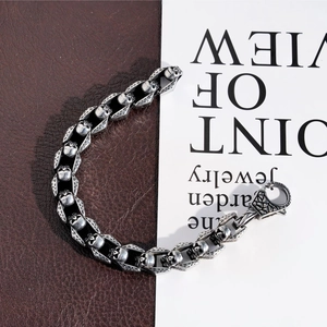 Macro detail of gothic skull link bracelet in vintage stainless steel with lobster clasp