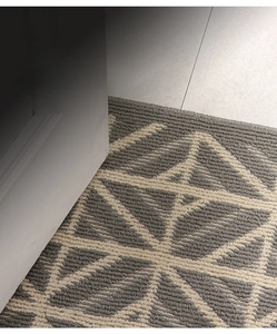 Detail of grey geometric star door mat showing slim profile to fit under low door gaps