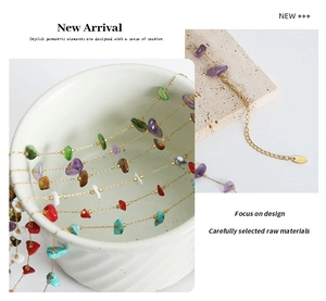Detailed macro view of handmade colorful natural stone beaded necklace with gold steel chain