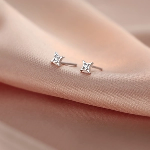 Minimalist S925 sterling silver four-pointed star stud earrings with cubic zirconia