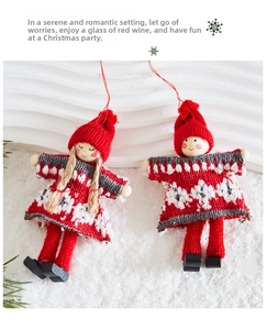 Close-up of handmade knitted Christmas gnome ornaments with wooden heads and red hats