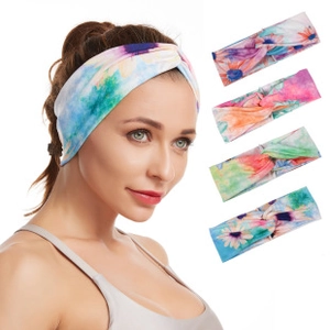 Detailed view of floral tie-dye pattern yoga headbands on model and flat lay arrangement