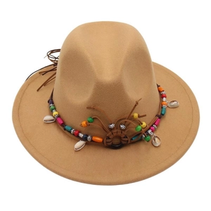 Detail view of khaki wool fedora with bohemian bead band and shell pendant accents