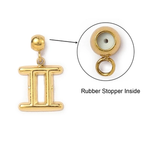Close-up of golden Gemini zodiac pendant with internal rubber stopper for DIY jewelry