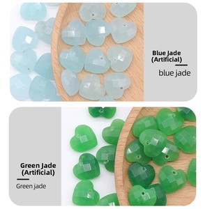 Macro view of 12mm faceted synthetic jade heart pendants in blue and green for DIY jewelry