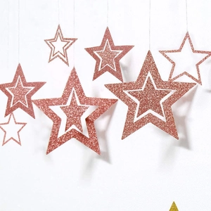 Set of 7 rose gold hollow star hanging decorations with glitter finish for holidays